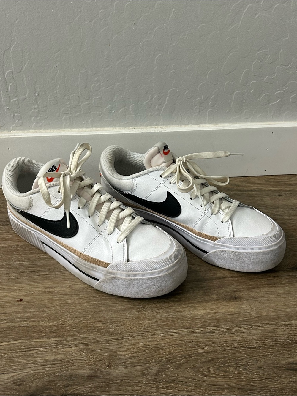 Nike White Sneakers with Black Swoosh and Tan Trim